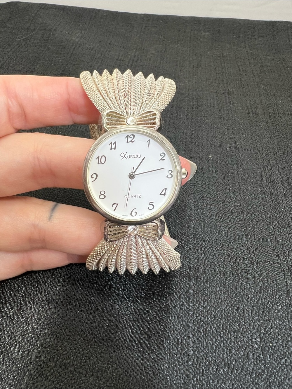 Xanadu quartz watch silver-tone cable-knit style band with bow-shaped silver ton